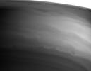 Turbulent swirls and eddies mark the southern boundary of Saturn's bright equatorial band in this image captured by NASA's Cassini spacecraft.