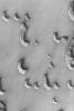NASA's Mars Global Surveyor shows a suite of Mars' north polar dunes in the early stages of the defrosting process.
