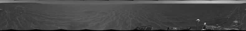 On Dec. 18, 2004, NASA's Mars Exploration Rover Opportunity was on its way from 'Endurance Crater' toward the spacecraft's jettisoned heat shield when the navigation camera took the images combined into this 360-degree panorama.