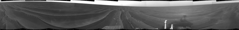 This cylindrical projection shows NASA's Mars Exploration Rover Opportunity's view of its surroundings on Feb. 19, 2005. Opportunity had reached the eastern edge of a small crater dubbed 'Naturaliste,' seen in the right foreground.