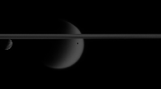 Three of Saturn's moons swim past in this frame from a movie sequence of images from NASA's Cassini spacecraft. These sequences, called mutual events, are useful for refining scientists' understanding the orbits of the moons.