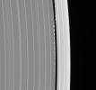 Daphnis, the tiny moon that inhabits the Keeler Gap in the outer edge of Saturn's A ring, is captured here in remarkable detail with its entourage of waves. This image was taken in visible light with NASA's Cassini spacecraft's narrow-angle camera.