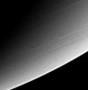 This view of high southern latitudes on Saturn shows very linear clouds at top, usually indicative of stable prevailing winds, and two turbulent, swirling features farther south. This image is from NASA's Cassini spacecraft