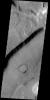 This crater on Mars appears to be in the process of being covered over by downslope movement of material. These large slopes of material are common in Deuteronilus Mensae as seen by NASA's 2001 Mars Odyssey.