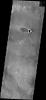 This windstreak is located on lava flows west of Arsia Mons on Mars as seen by NASA's 2001 Mars Odyssey spacecraft.