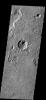 The arcuate fractures seen in this image are common along the highland/lowland boundary on Mars as seen by NASA's Mars Odyssey spacecraft.
