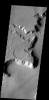 This interesting tributary channel is located in the Deuteronilus region of Mars on Mars as seen by NASA's Mars Odyssey spacecraft.