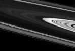 The dramatic plane of Saturn's rings is indeed a huge expanse. Gazing straight across the vertical center of this view, NASA's Cassini spacecraft takes in more than 200,000 kilometers (124,000 miles) from one side of the rings to the other.