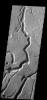 These channels and channel-like collapse features are located on the northeastern flank of Ascraeus Mons on Mars as seen by NASA's Mars Odyssey spacecraft.