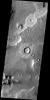 This image from the Deuteronilus Mensae region shows an interesting portion of the martian dichotomy. It appears that the crater in the upper part of the image is being re-exposed after burial on Mars as seen by NASA's Mars Odyssey spacecraft.