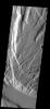 This faulted and eroded surface is part of Acheron Fossae on Mars as seen by NASA's 2001 Mars Odyssey spacecraft.