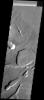 This images shows part of the northeastern flank and margin of Pavonis Mons on Mars. Collapse features are common on the margins of the Tharsis volcanoes along the vent axis as seen by NASA's 2001 Mars Odyssey spacecraft.