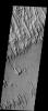 These yardangs - wind eroded ridges - are part of Eumenides Dorsum on Mars as seen by NASA's 2001 Mars Odyssey spacecraft.