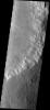 This small landslide on Mars is located in an unnamed crater as seen by NASA's Mars Odyssey spacecraft.