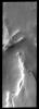This image from NASA's Mars Odyssey spacecraft shows the margin of Mars' south polar cap with several ridges. Gullies have formed on the east side of the mesa at the bottom of the image.