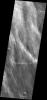 This image from NASA's Mars Odyssey spacecraft shows several bands of clouds over the plains to the west of Peneus Patera in the southern hemisphere of Mars.