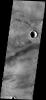 This image from NASA's Mars Odyssey spacecraft shows a strip of ground in the Daedalia Planum region of the giant volcanic province of Tharsis. The lava flows come from the Arsia Mons volcano on Mars.