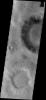 This image from NASA's Mars Odyssey spacecraft shows small, dark dunes in Ruza Crater moving from the crater floor to the crater rim. With the passage of time and continued wind activity the leading dunes will exit the crater completely.