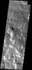 This image from NASA's Mars Odyssey spacecraft shows part of the flank of the Arsia Mons volcano on Mars. The surface of the flank comprised of small ridges and honeycomb-like depressions.