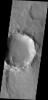 This image from NASA's Mars Odyssey spacecraft shows dark slope streaks on the interior rim of a crater in Terra Sabaea marking locations where the upper layer of dust has been removed, exposing the darker rock beneath.