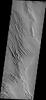 This image from NASA's Mars Odyssey spacecraft shows a very small portion of the Medusa Fossae Formation on Mars, an extensive deposit of poorly cemented materials that is heavily wind eroded.