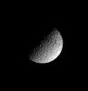 Deep craters riddle the pulverized, icy surface of Saturn's moon Mimas in this image captured by NASA's Cassini spacecraft on June 16, 2008.