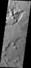 This image from NASA's Mars Odyssey shows a small region of wind erosion and deposition in the Tharsis area on Mars.