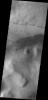 This image from NASA's Mars Odyssey shows dark dunes located west of Barabashov Crater on the northern margin of Tempe Terra.