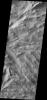 This image from NASA's Mars Odyssey shows dark slope streaks common in the Lycus Sulci, the hightly fractured materials north of Olympus Mons.
