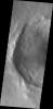 This image from NASA's Mars Odyssey shows an unnamed crater in western Utopia Planitia containing both gullies and a landslide deposit that may be related to the formation of some gullies.