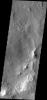 This image from NASA's Mars Odyssey shows dark slope streaks located on an ancient crater rim near Henry Crater on Mars.