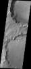 This image from NASA's Mars Odyssey shows failure of the rim of this unnamed crater in Terra Sabaea forming two small landslide deposits. A scalloped shape of the rim is left by the removal of material.