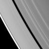 Saturn's moon Pan casts a delicate shadow onto the planet's A ring. NASA's Cassini spacecraft took this image on May 2, 2009.
