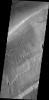 This image taken by NASA's 2001 Mars Odyssey shows secondary channeling on a terrace of the huge Kasei Valles outflow system.