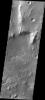 NASA's 2001 Mars Odyssey captured this image of a channel entering Eberswalde Crater and depositing a fan-shaped delta on the crater floor.