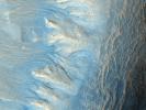 This image from NASA's Mars Reconnaissance Orbiter shows the west-facing side of an impact crater in the mid-latitudes of Mars' northern hemisphere. This crater has gullies along its walls that are composed of alcoves, channels and debris aprons.