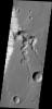 This image from NASA's 2001 Mars Odyssey shows a complex tributary channel and its entry to the main channel of Shalbatana Vallis.