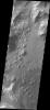 This image from NASA's Mars Odyssey shows part of the floor of Ganges Chasma. Deposits of fine surface materials and bright layered deposits are visible in this image.