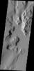 Lycus Sulci is an extremely complex region surrounding the western and northern flanks of Olympus Mons. With a multitude of fault formed cliff faces, dark slope streaks are a common occurrence. This image was captured by NASA's Mars Odyssey.