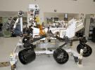 The rover for NASA's Mars Science Laboratory mission, named Curiosity, is about 3 meters (10 feet) long, not counting the additional length that the rover's arm can be extended forward. The front of the rover is on the left in this side view.