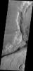 Huge fractures cutting through the surface of Terra Sirenum are called Memnonia Fossae. The term fossa(e) means linear depression. This image is from NASA's 2001 Mars Odyssey.