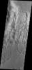 This image from NASA's 2001 Mars Odyssey spacecraft shows part of the mesa and valley terrain called 'chaos.' This region of chaos is near the far eastern end of Valles Marineris.