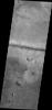 This image from NASA's 2001 Mars Odyssey spacecraft shows a fracture north of Argyre Planitia. Note the dunes within the channel.
