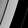 The tiny wavemaker moon Daphnis is dwarfed by the very waves it creates on the edge of the Keeler gap as seen by NASA's Cassini spacecraft.