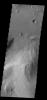 Gale Crater contains a large layered deposit, part of which is shown in this image captured by NASA's 2001 Mars Odyssey spacecraft. This deposit is the target of the Curiosity Lander due to land in early August 2012.