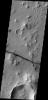 The fracture is this image captured by NASA's 2001 Mars Odyssey spacecraft cuts right through a hill, indicating tremendous tectonic stresses were at work to create this feature.