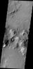 Gravity driven slope modification creates the dark marks on the crater rim in this unnamed crater in Terra Sabaea as seen by NASA's 2001 Mars Odyssey spacecraft.