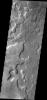 This image from NASA's 2001 Mars Odyssey spacecraft shows the floor of an unnamed crater east of Aram Chaos and Ares Vallis. There are two distinct elevations on the crater floor, which may indicate layered fill material.