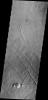 This image from NASA's 2001 Mars Odyssey spacecraft of the Tharsis region illustrates relative age relations. Fractures occurred in old lava flows and then younger lava flows covered the fractures.