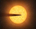 This artist's concept depicts a comet-like tail of a possible disintegrating super Mercury-size planet candidate as it transits, or crosses, its parent star, named KIC 12557548. The results are based on data from NASA's Kepler mission.
